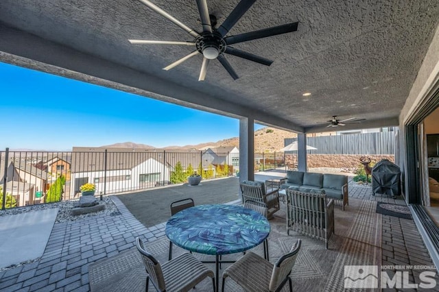 view of patio / terrace with area for grilling and ceiling fan