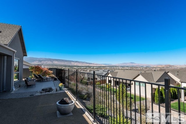 balcony with a patio area and a mountain view