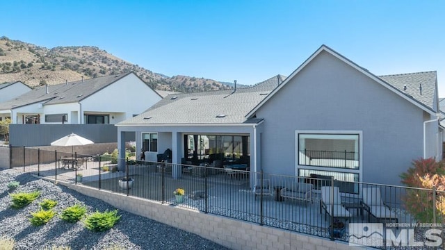 rear view of house with a mountain view