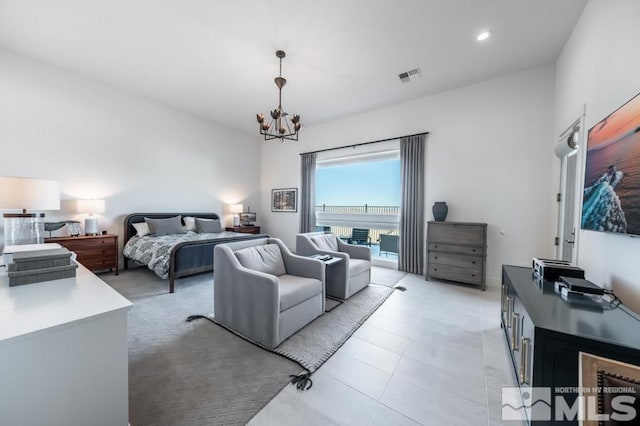 bedroom featuring an inviting chandelier