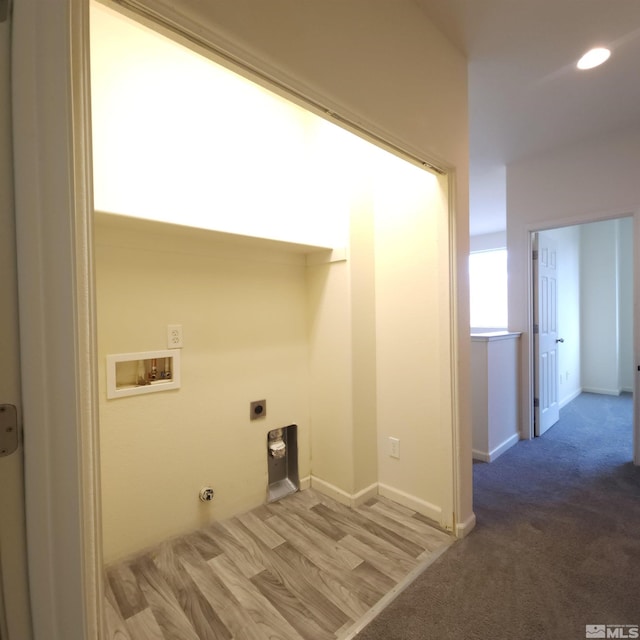 laundry room featuring light hardwood / wood-style floors, gas dryer hookup, washer hookup, and hookup for an electric dryer