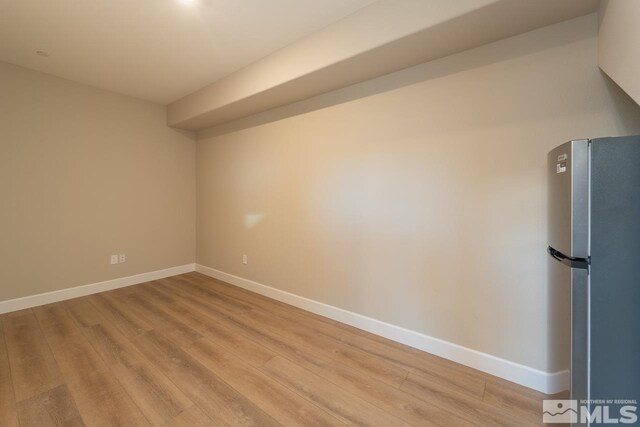 empty room with light wood-type flooring