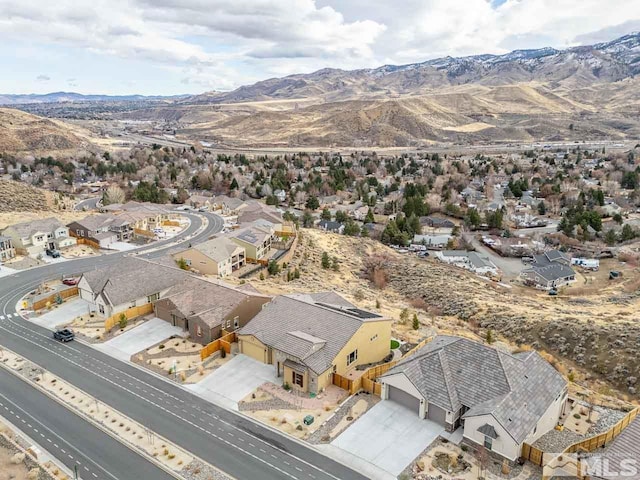 birds eye view of property with a mountain view