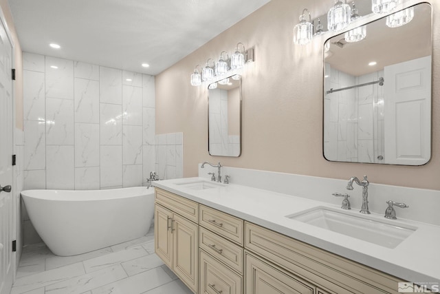 bathroom with shower with separate bathtub and vanity