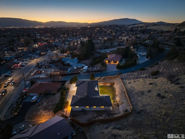 aerial view at dusk with a mountain view