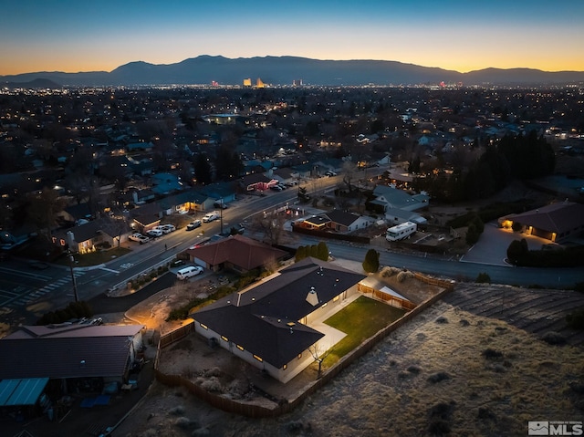 aerial view at dusk with a mountain view