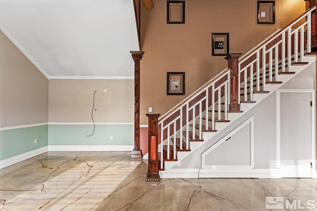 stairs featuring crown molding