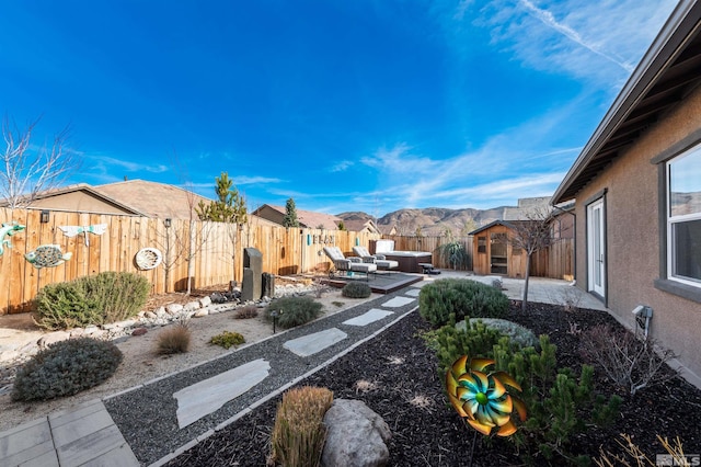 view of yard with a mountain view and a patio area