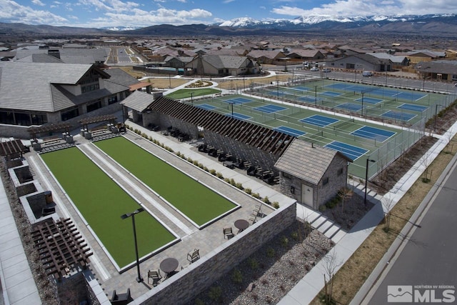 birds eye view of property featuring a mountain view