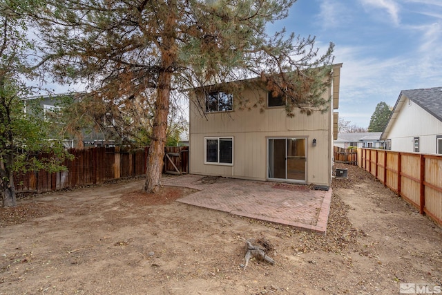 back of property featuring a patio