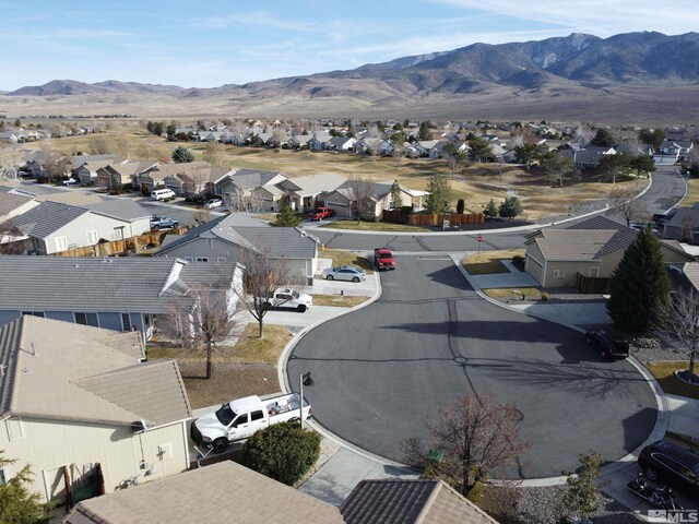 birds eye view of property featuring a mountain view