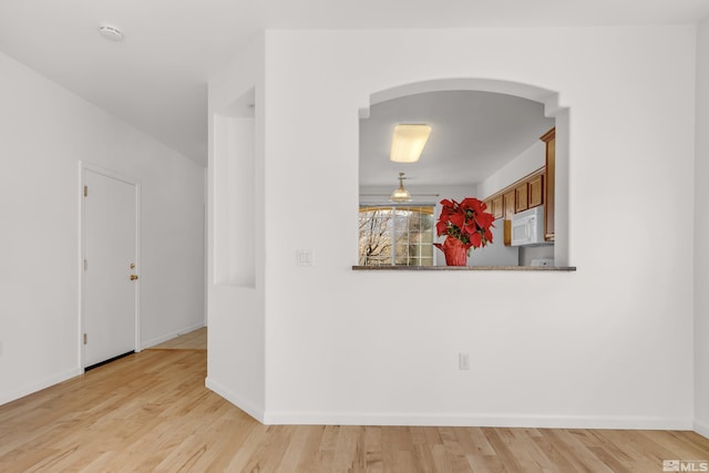 spare room featuring light hardwood / wood-style floors