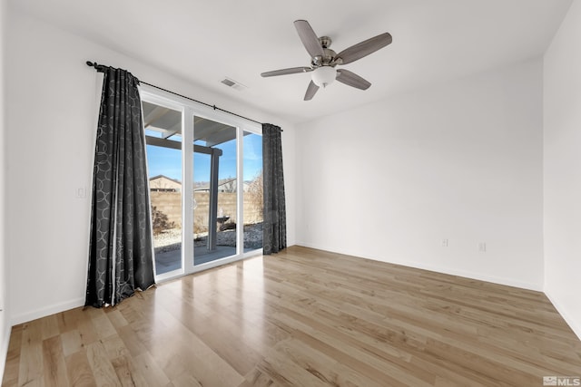 empty room with ceiling fan and light wood-type flooring