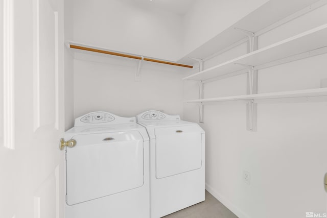 washroom with washer and dryer