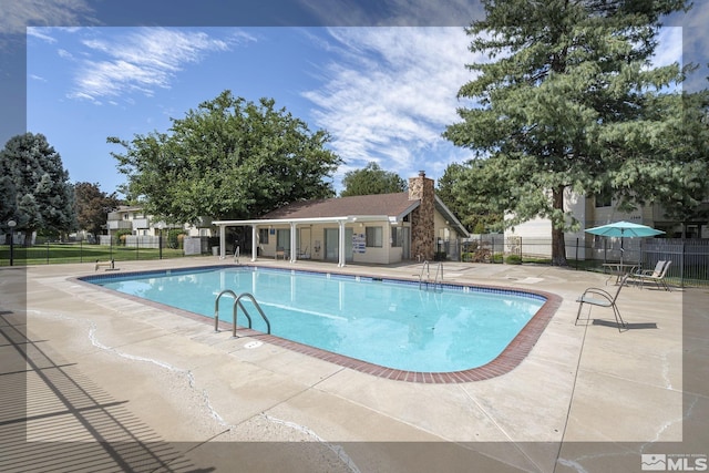 view of pool featuring a patio