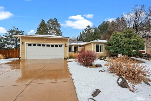 ranch-style home featuring a garage