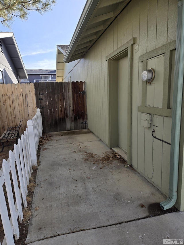 view of side of property featuring fence