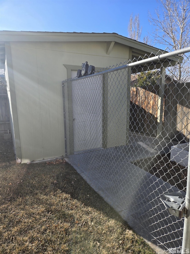 view of outbuilding with fence