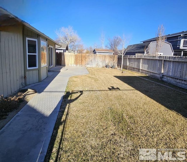 view of yard with a fenced backyard