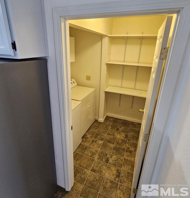 clothes washing area with laundry area and washing machine and dryer