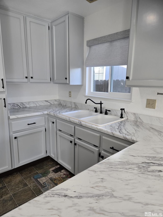 kitchen with sink and white cabinets