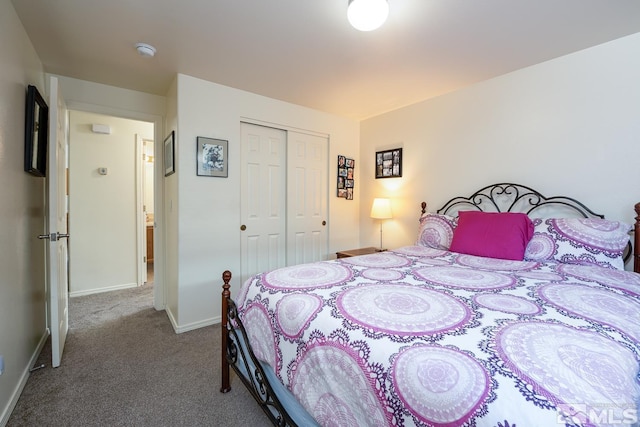 bedroom with carpet and a closet