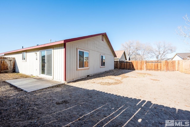 rear view of house featuring a patio