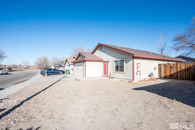 back of property featuring a garage