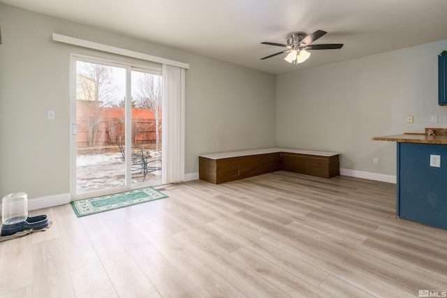 interior space featuring light wood-type flooring and ceiling fan