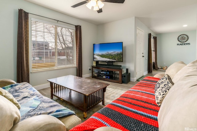 living room with ceiling fan and light wood-type flooring