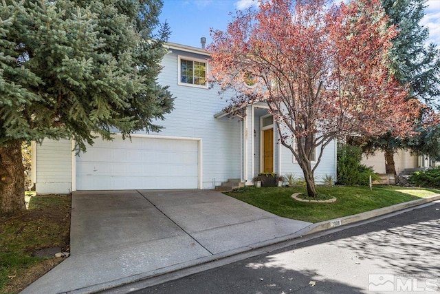 obstructed view of property with a front yard and a garage