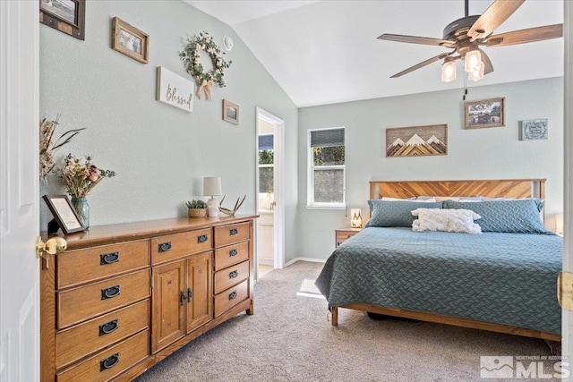 bedroom featuring light carpet, ceiling fan, and vaulted ceiling