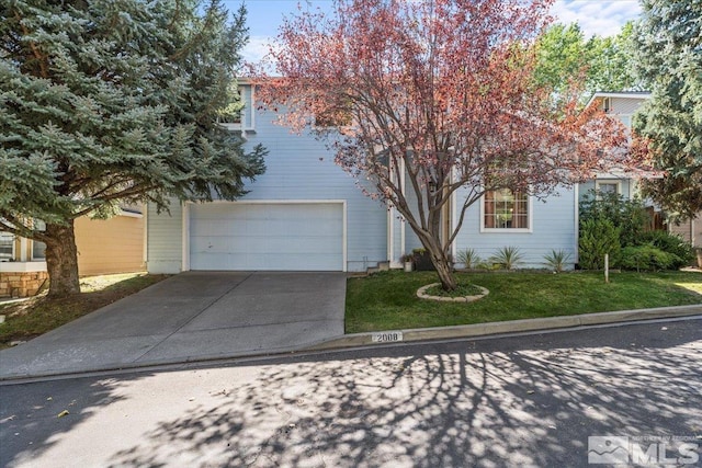 obstructed view of property featuring a front yard and a garage