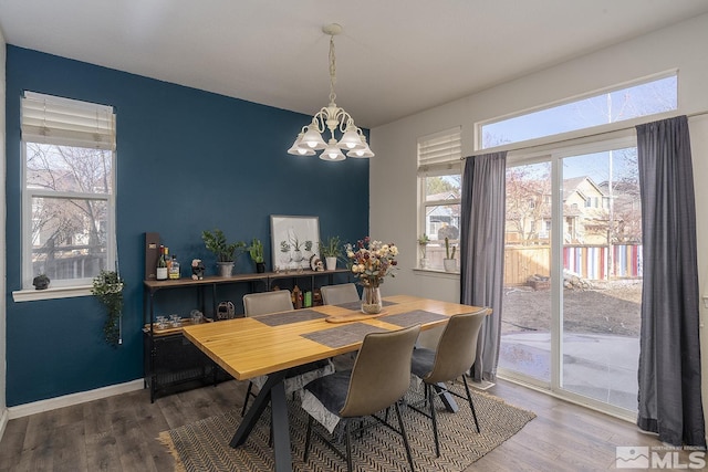 dining room featuring a chandelier and hardwood / wood-style flooring