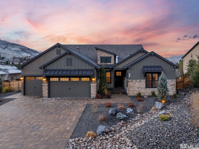 craftsman inspired home featuring a mountain view and a garage