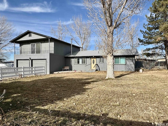 rear view of property with a garage