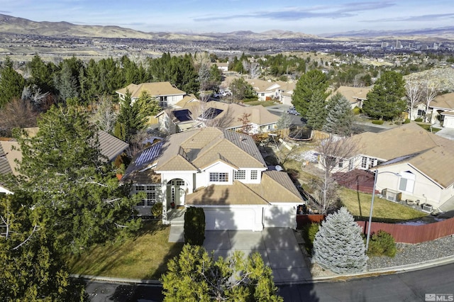 birds eye view of property featuring a mountain view