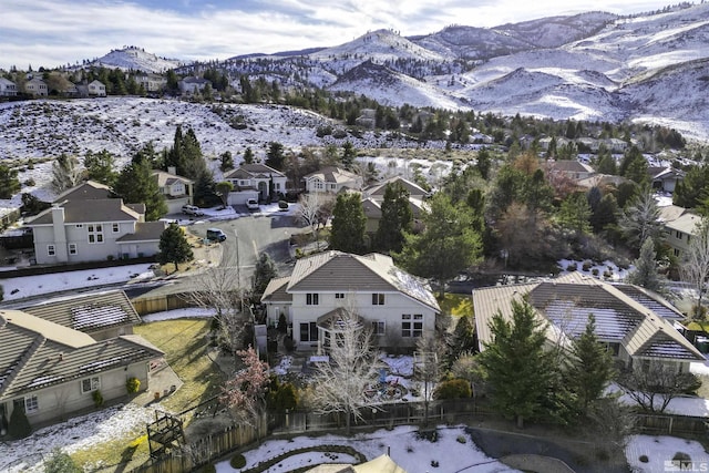 snowy aerial view featuring a mountain view