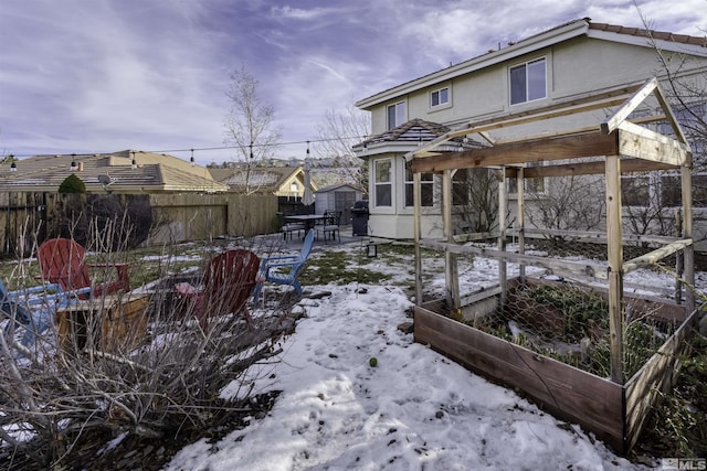 view of yard layered in snow