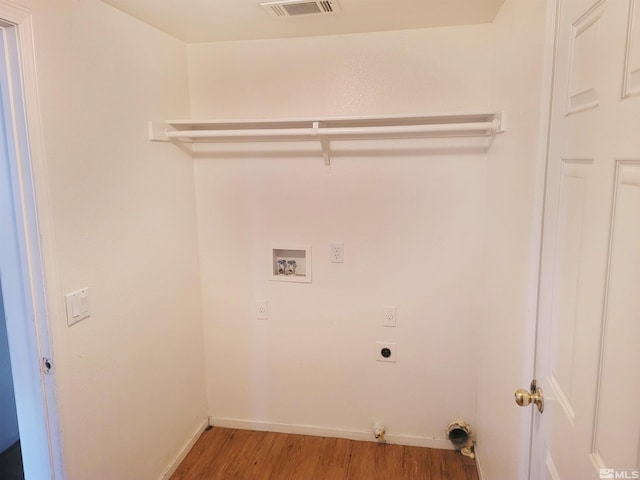 laundry area featuring hookup for an electric dryer, washer hookup, hardwood / wood-style flooring, and gas dryer hookup