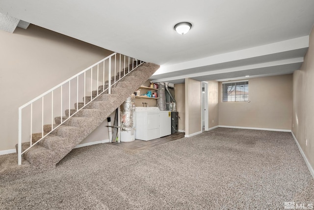 basement featuring washer and clothes dryer and carpet