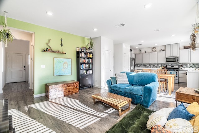 living room with dark wood-type flooring