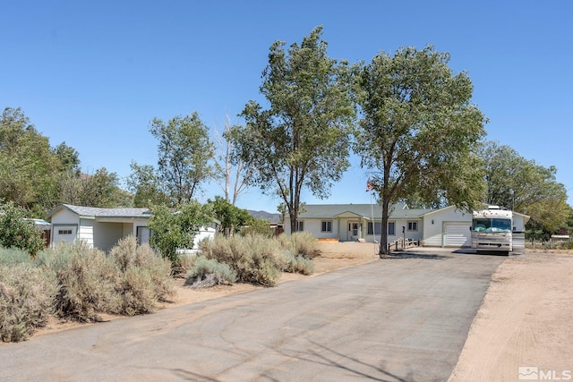 ranch-style house featuring a garage