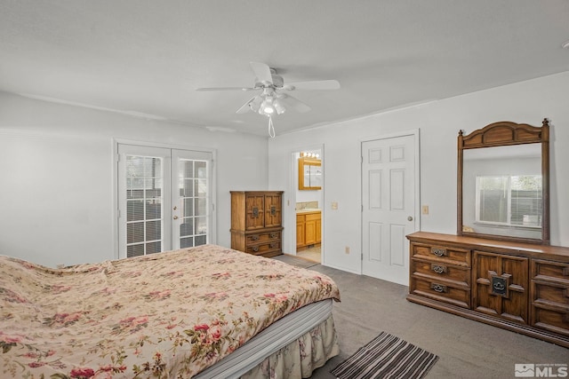 bedroom with ceiling fan, light colored carpet, connected bathroom, and multiple windows