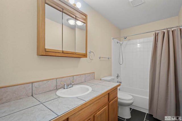 full bathroom with tile patterned floors, vanity, shower / bath combination with curtain, and toilet