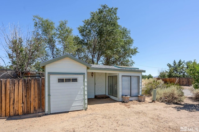 view of front of property with an outdoor structure