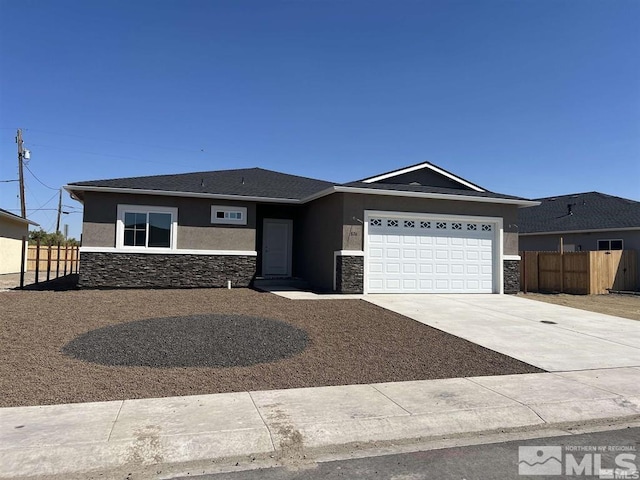 ranch-style home featuring a garage