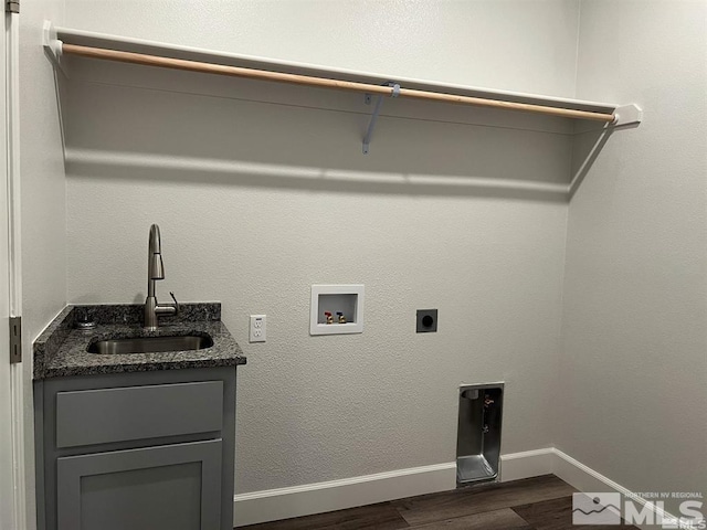 clothes washing area with sink, cabinets, washer hookup, hookup for an electric dryer, and dark hardwood / wood-style floors