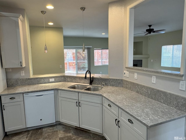 kitchen with white cabinetry, sink, ceiling fan, kitchen peninsula, and white dishwasher