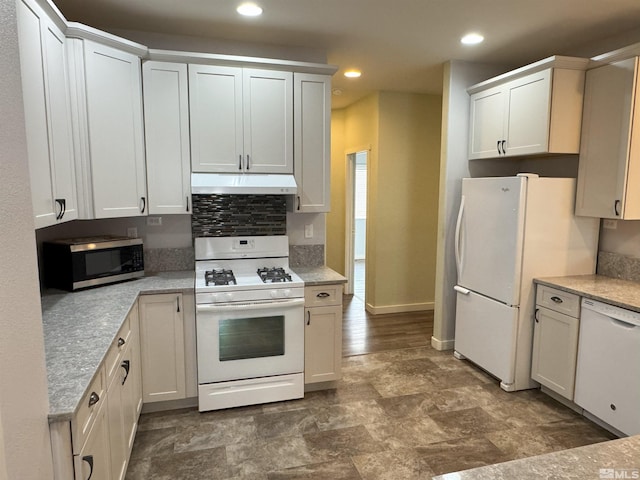 kitchen with white appliances and white cabinetry